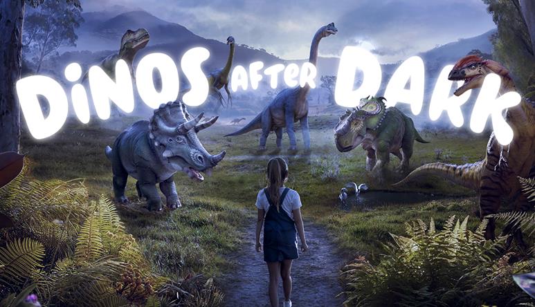 "Dinos After Dark": a young guest, seen from behind, stands before six dinosaurs in a night-time setting.